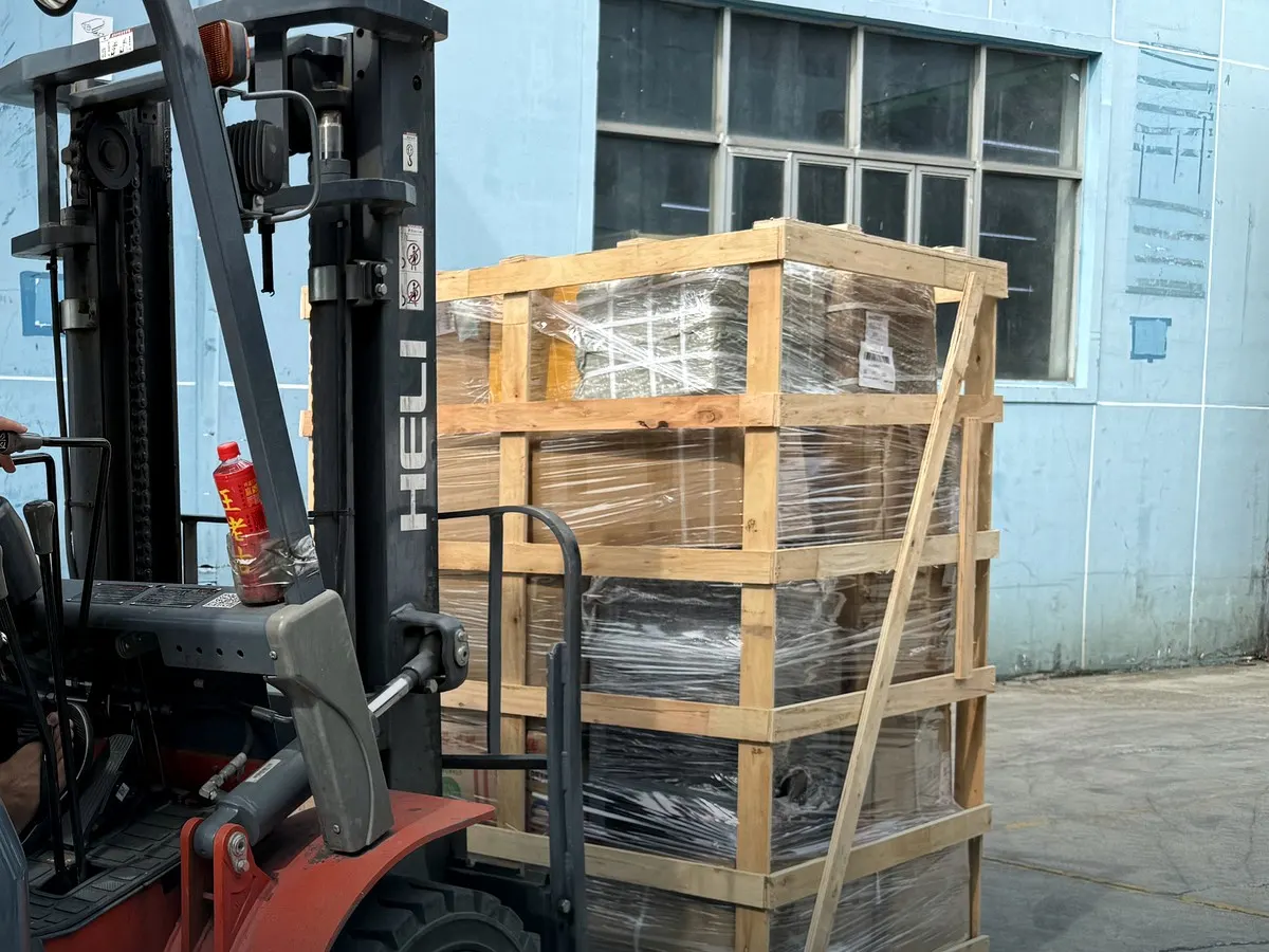 Forklift transferring a protected wooden crate