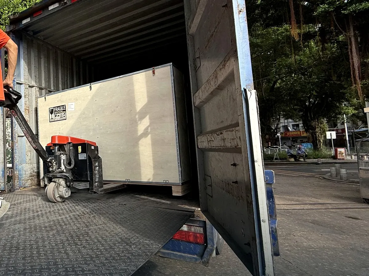 Large packed crate being loaded into a truck