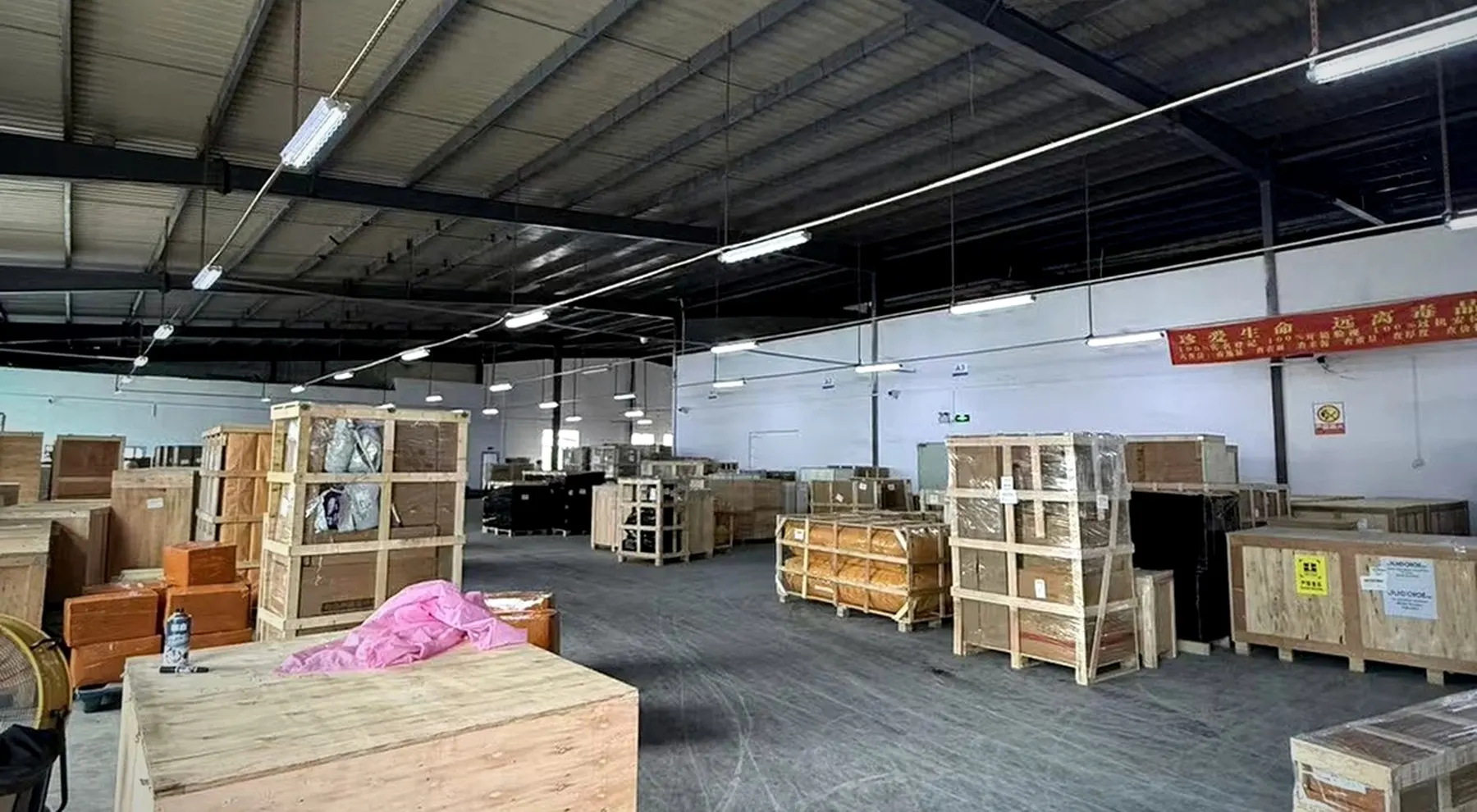 HYHF warehouse with rows of packed furniture and bulky cargo